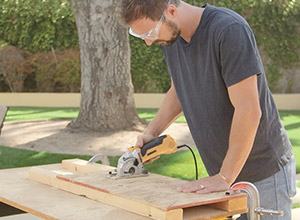 Cutting wood outside